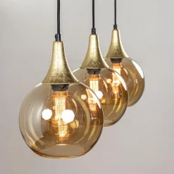 Chique 3-lichts hanglamp zwart/goud met amber glas></noscript>Straluma Best