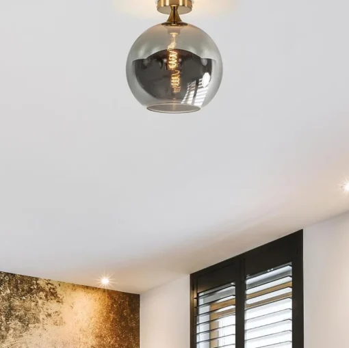 Chique plafondlamp goud met smoke/titanium glazen bol>Straluma Best