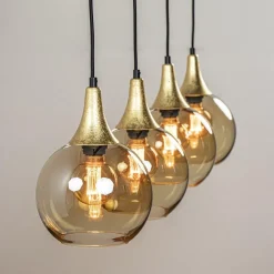 4-Lichts eettafelhanglamp zwart/goud met amber glazen bollen></noscript>Straluma Hot