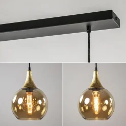 4-Lichts eettafelhanglamp zwart/goud met amber glazen bollen></noscript>Straluma Hot