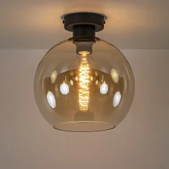 Mat zwarte plafondlamp met amber glazen bol></noscript>Straluma Online
