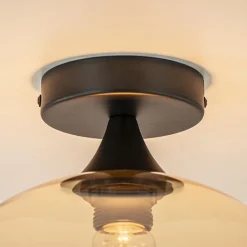 Mat zwarte plafondlamp met amber glazen bol 30 cm></noscript>Straluma Best