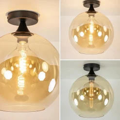 Mat zwarte plafondlamp met amber glazen bol 30 cm></noscript>Straluma Best